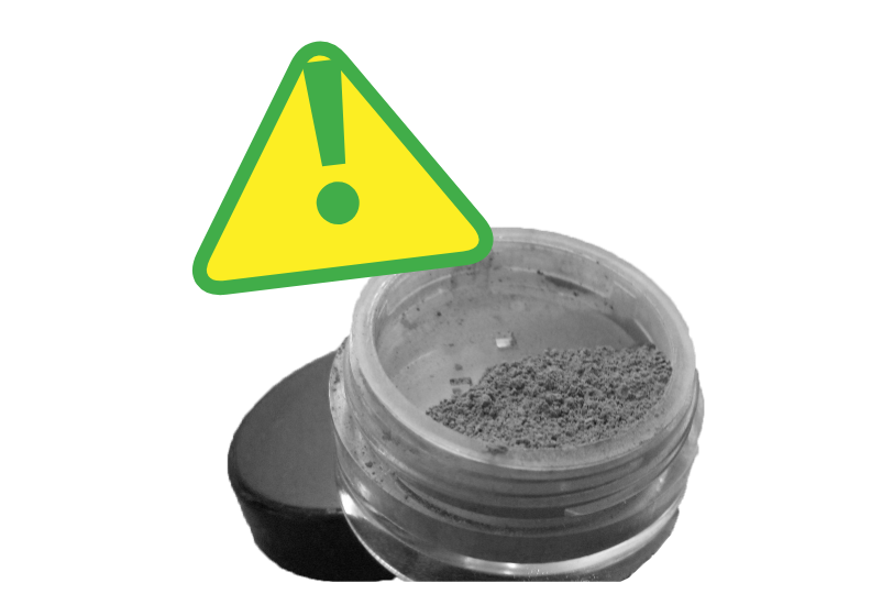 A hazard symbol in bright yellow with a green exclamation mark overlapping a round ingredient container