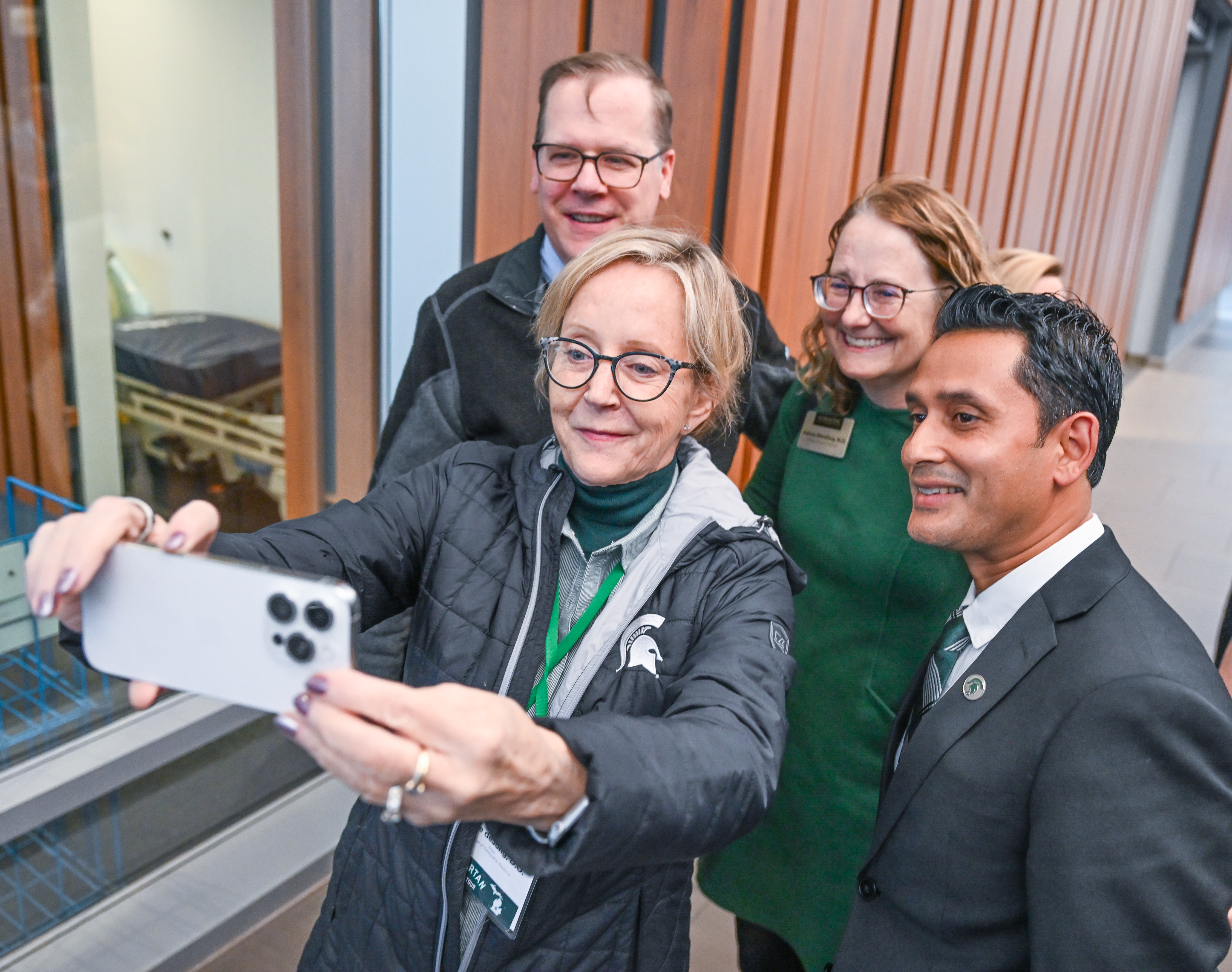Participants of the Spartan Bus Tour 2025 Regional Route Upper Peninsula pose in front of the bus. Photo by Derrick L. Turner