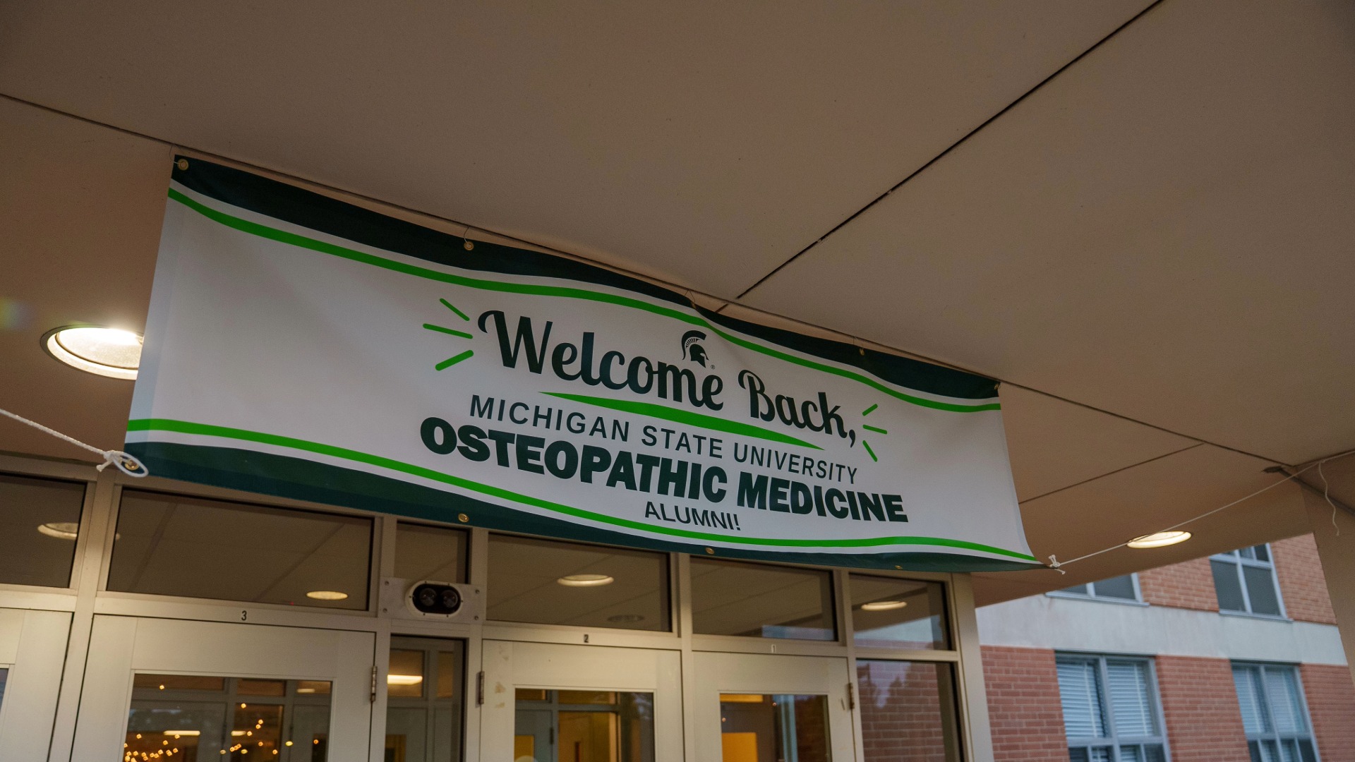 A hanging banner reads 