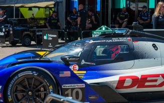 Blue race car sitting parked in the pit during a race at the 2026 Detroit Grand Prix