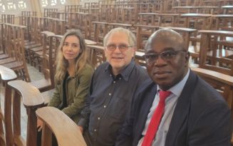 Dr. Itziar, Dr. Boivin, and Professor Desire Tshala-Katumbay pose for a selfie at a dedication service in Kinshasa, Democratic Republic of the Congo.