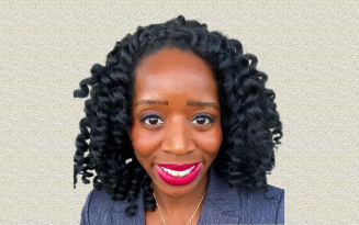 Headshot of author Bisi Alli, D.O., smiling in a light blue suit jacket in front of a textured tan background.