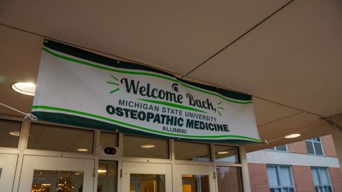 A hanging banner reads 